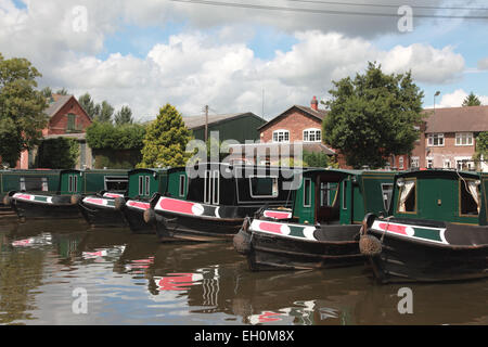 Hire boats belonging to canal narrowboat holiday company Anglo Welsh moored at their base at Great Haywood in Staffordshire Stock Photo