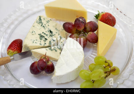 Selection of cheeses with grapes Stock Photo