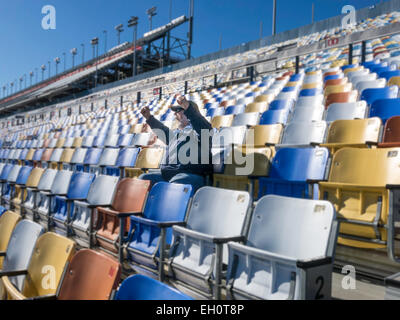 Lone Spectator Cheering at the Daytona International Speedway, Florida, USA Stock Photo