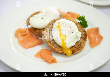 Two poached eggs on toast with smoked salmon Stock Photo