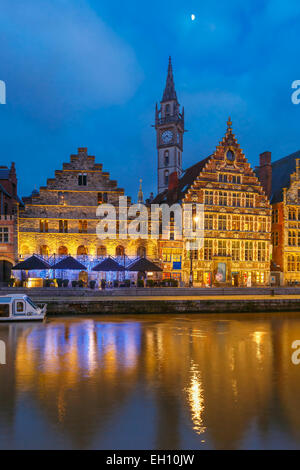 Picturesque medieval building and Clock Tower on the quay Graslei in Leie river at Ghent town at morning, Belgium Stock Photo