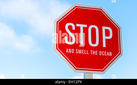 A 'stop and smell the ocean' traffic, street sign in southern California Stock Photo