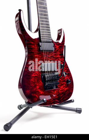 red seven-stringed electric guitar isolated on white background Stock Photo