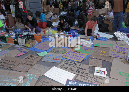 Painted placards displayed on the sidewalk at the Occupy Wall Street protest in Zuccotti Park, New York Stock Photo