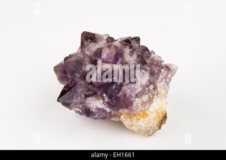 Mineral, Gemstone - Large Amethyst Crystal in the rough with Quartz and Citrine on a white background. Stock Photo