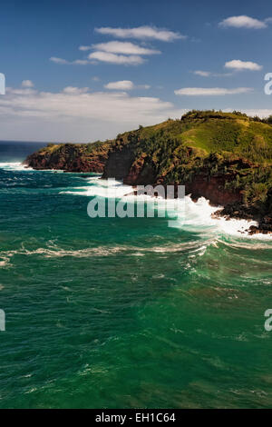 The relentless Pacific Ocean crashes against the cliffs overlooking Honolua Bay on Hawaii's island of Maui. Stock Photo