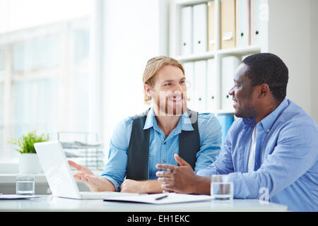 Two office workers talking Stock Photo