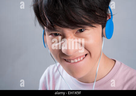 Young man listening to music Stock Photo
