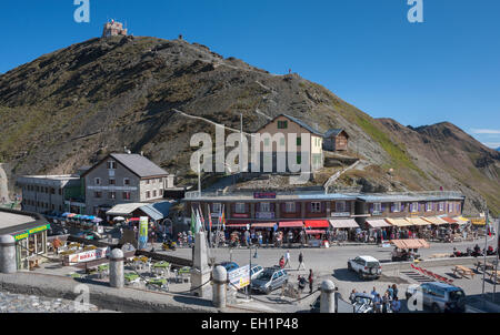 Stelvio Pass, 2757 m, tourist shops on the pass road, at the top Mt Dreisprachenspitze with the Garibaldi Refuge, Panorama Ridge Stock Photo