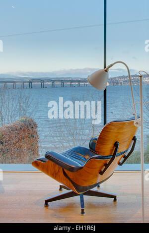 Charles Eames armchair at window of Wormit House, Fife, Scotland Stock Photo