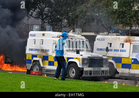 Nationalist youth throwing petrol bombs at PSNI vehicles during riots in the Bogside, Derry, Londonderry, Northern Ireland Stock Photo