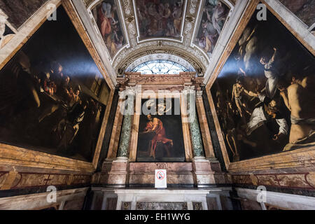 Rome. Italy. Paintings by Caravaggio in the Contarelli Chapel, Chiesa di San Luigi dei Francesi. Inspiration of St Matthew (centre) Stock Photo