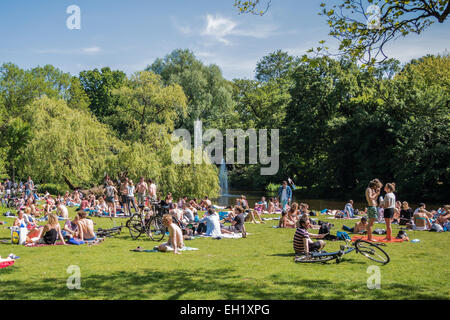 Crowds of people enjoying the sun in Vondelpark amsterdam Stock Photo