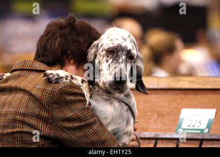 Birmingham, UK. 5th March, 2015. An owner hugs her English Setter at Crufts which started today in Birmingham, UK. Credit:  Jon Freeman/Alamy Live News Stock Photo