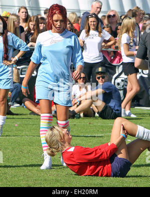 Countdown's Rachel Riley takes a tumble during the Soccer SixFest 2014 event at Mile End Stadium Featuring: Amy Childs and Rachel Riley Where: London, United Kingdom When: 31 Aug 2014 Stock Photo