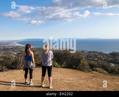 Hikers on the Temescal Ridge Trail in Temescal Canyon Gateway Park, which traverses Topanga State Park,  admire ocean view