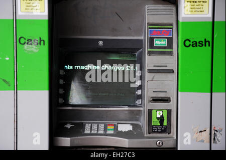 Tatty looking ATM cash machine that charges to make withdrawals Brighton UK Stock Photo