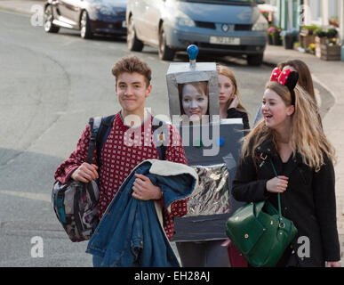 Group of teenagers two in fancy dress for a charity dress Stock Photo