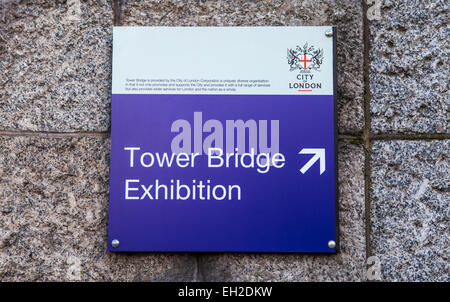 LONDON, UK - 4TH MARCH 2015: A sign for the Tower Bridge Exhibition tourist attraction in London on 4th March 2015. Stock Photo