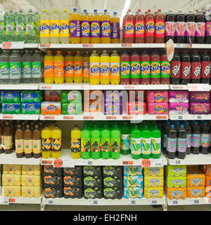 Variety of soft drinks on supermarket shelves