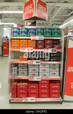 Variety of soft drinks on supermarket shelves including Coca Cola, Diet Coke and Fanta orange Stock Photo