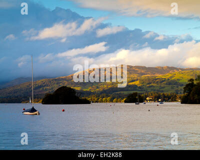 View across Lake Windermere in the Lake District National Park Cunbria UK showing boats on the water and fells in the background Stock Photo