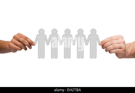 hands holding paper chain people Stock Photo
