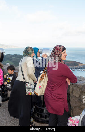 adult women, tourists, visitors, looking through viewfinder, north side of Golden Gate Bridge, Vista Point, city of Sausalito, California Stock Photo