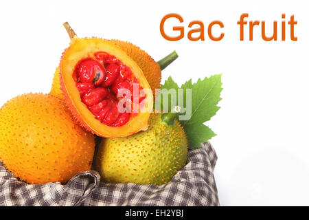 Gac fruit, Baby Jackfruit, Spiny Bitter Gourd in wooden crate Stock Photo