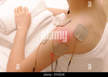 https://l450v.alamy.com/450v/eh302k/asian-woman-is-doing-massage-of-electrical-stimulation-tens-for-the-eh302k.jpg