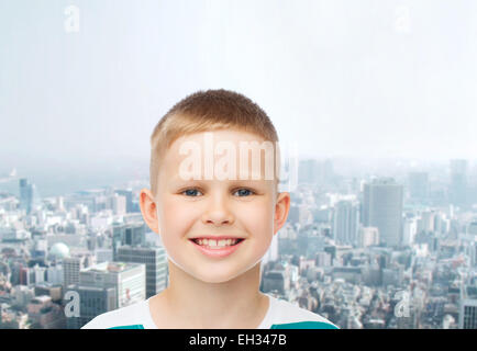 smiling little boy over green background Stock Photo