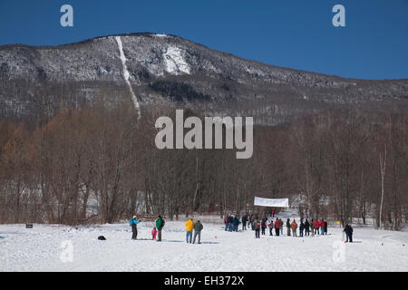Spectators wait at the finish line for skiers to arrive from the Thunderbolt Trail at Mount Greylock, Adams, Massachusetts. Stock Photo