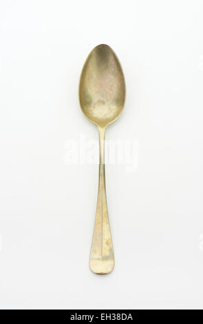 Old silver spoon on white background Stock Photo