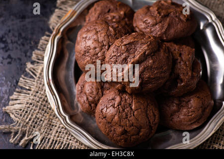 Homemade chocolate cookies on dark background, selective focus, top view Stock Photo