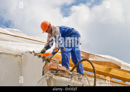 Bricklayer at restoration work in a Moscow district. Russia Stock Photo