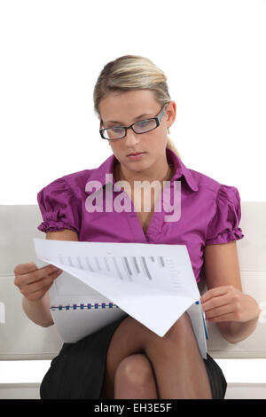 Woman going over financial results Stock Photo