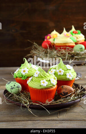 set of easter cupcakes on rustic table Stock Photo