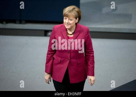 Berlin, Germany. 06th Mar, 2015. German chancellor Angela Merkel (CDU) walks through the plenary room during a session of parliament in Berlin, Germany, 06 March 2015. The parliament approved a bill to introduce a 30 percent quota for women on supervisory boards. Photo: Soeren Stache/dpa/Alamy Live News Stock Photo