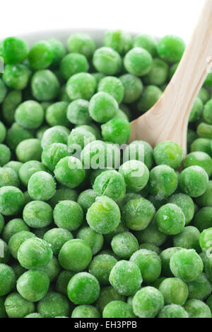 Frozen green peas in a bowl. Stock Photo