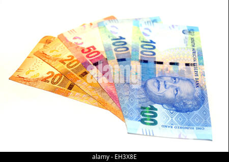 South African Rand notes featuring the face of Nelson Mandela photographed against a white background. Stock Photo