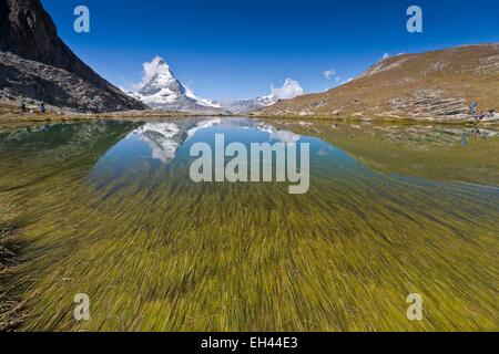 Switzerland, canton of Valais, Zermatt, the Matterhorn (4478m) from Lake Riffelsee Stock Photo
