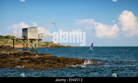 France, Loire Atlantique, Pornic, Portmain, traditional carrelet fishing hut with lift net and windsurfing Stock Photo