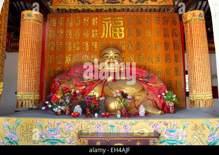 Buddha statue displaying the 'fat buddha' in a Chinese temple located in one of China's famous Water Towns. Stock Photo