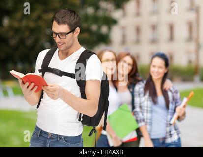 travelling student with backpack and book Stock Photo