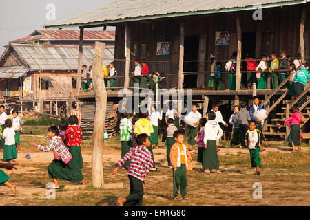 Young children in school;  schoolchildren playing in their school playground, Kay Lar village primary school, Inle Lake, Myanmar ( Burma ), Asia Stock Photo