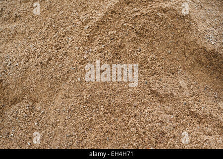 Coarse sand background texture. Closeup of coarse sand grains. Stock Photo