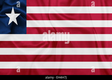 Liberia - Waving national flag on silk texture Stock Photo