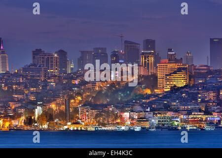 Turkey, Istanbul, Besiktas district, night view of a modern urban landscape by the sea Stock Photo