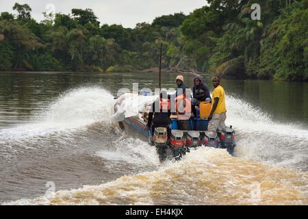 Gabon, Ogooue-Maritime Province, freight transport on a motor boat going down a river of the Fernan Vaz (Nkomi) lagoon Stock Photo