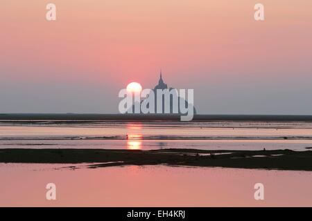 France, Manche, Mont Saint Michel bay, listed as World Heritage by UNESCO, sunrise on Mont Saint Michel at high tide